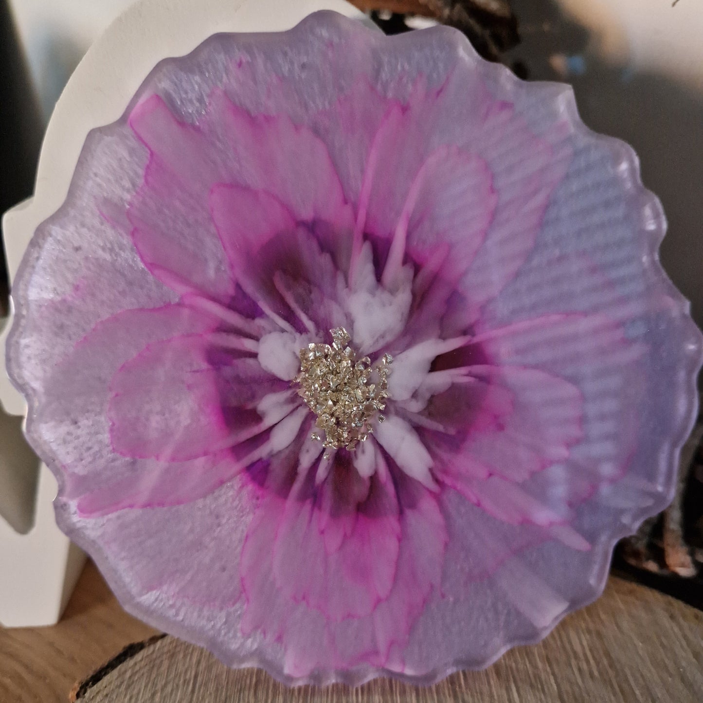 Resin bloom coaster with fuchsia alcohol ink design
