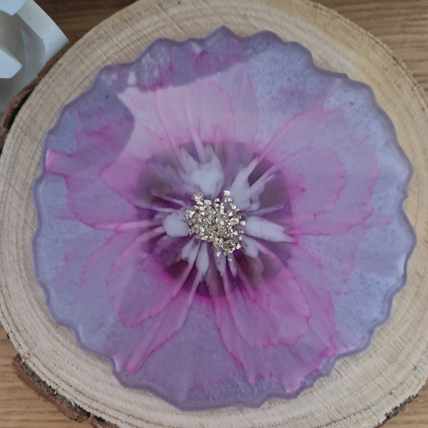 Resin bloom coaster with fuchsia alcohol ink design