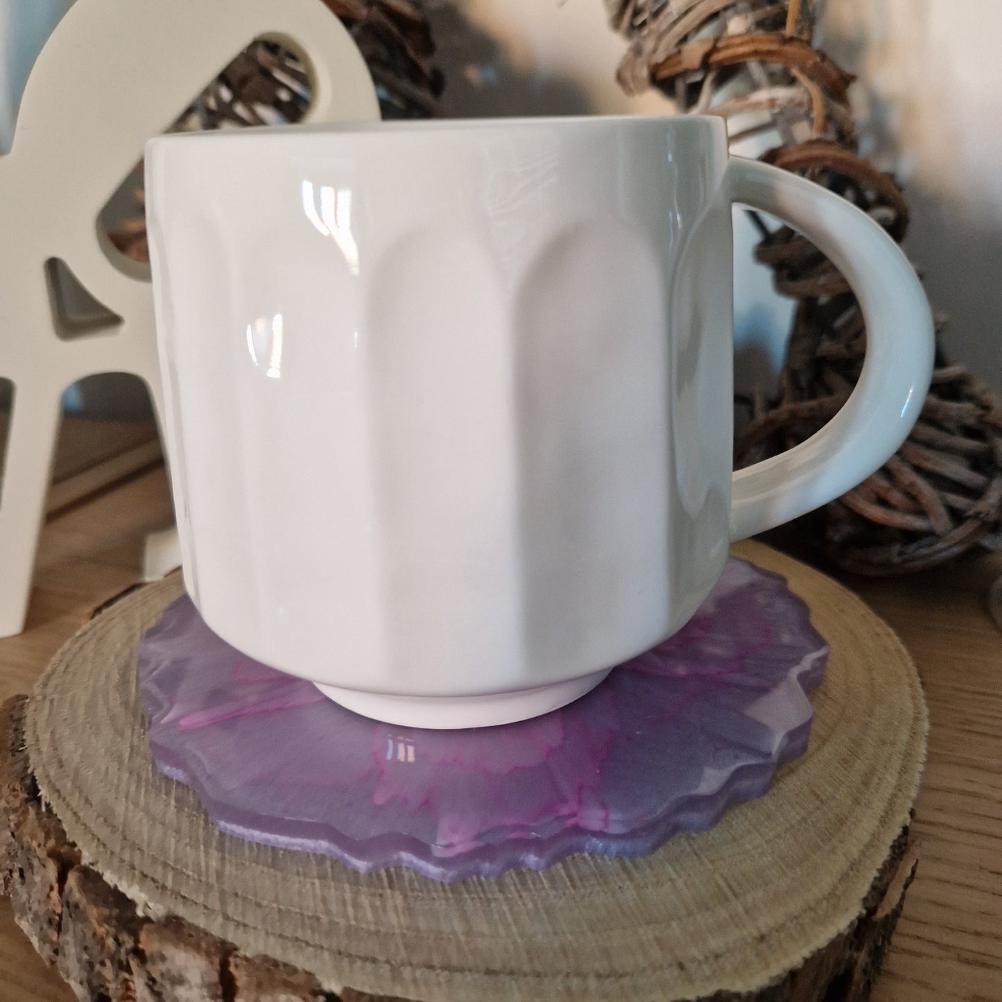 Resin bloom coaster with fuchsia alcohol ink design