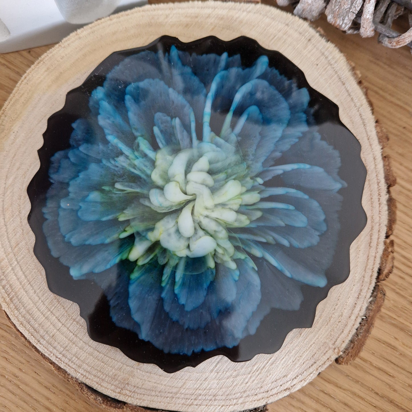 Resin bloom coasters with blue alcohol ink design