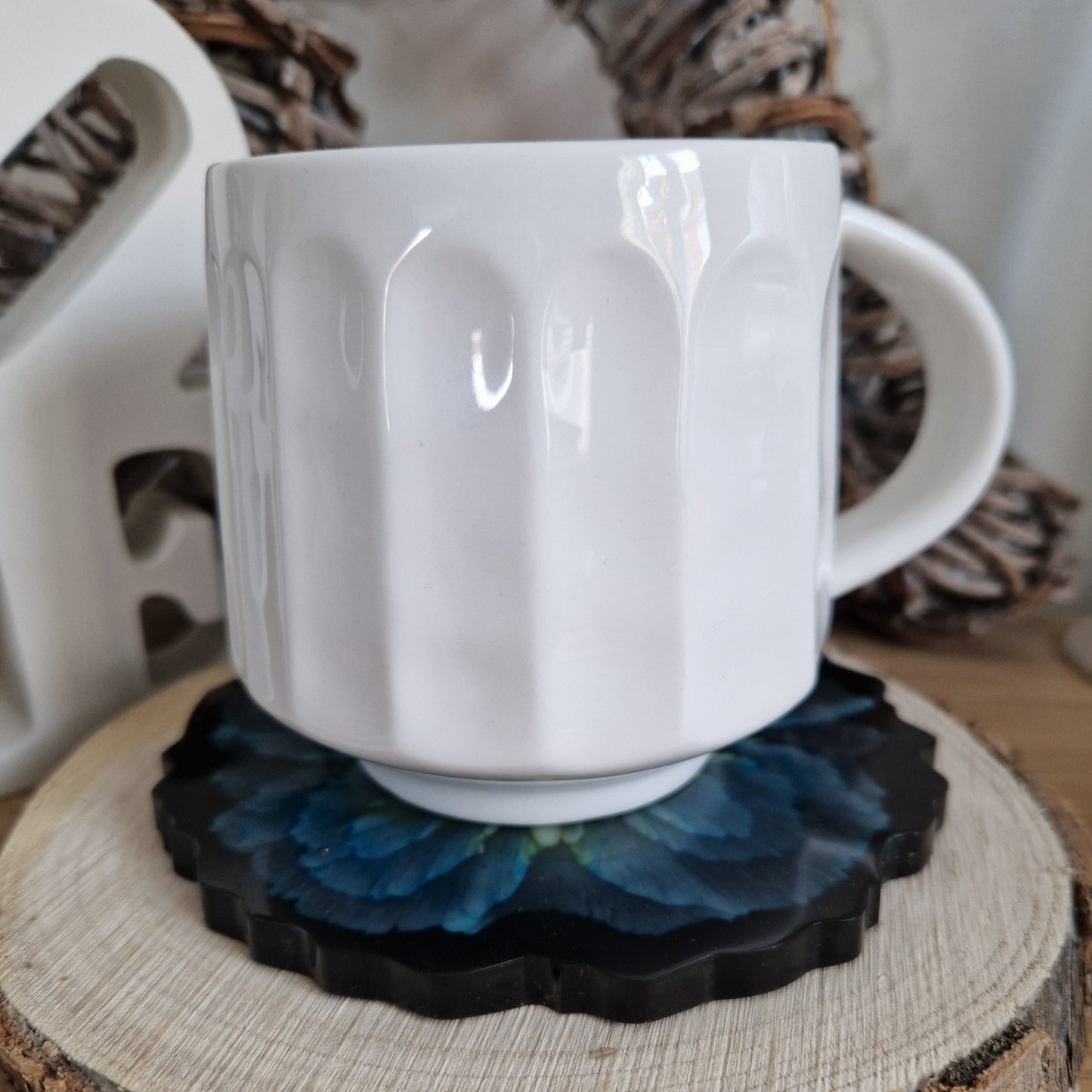 Resin bloom coasters with blue alcohol ink design