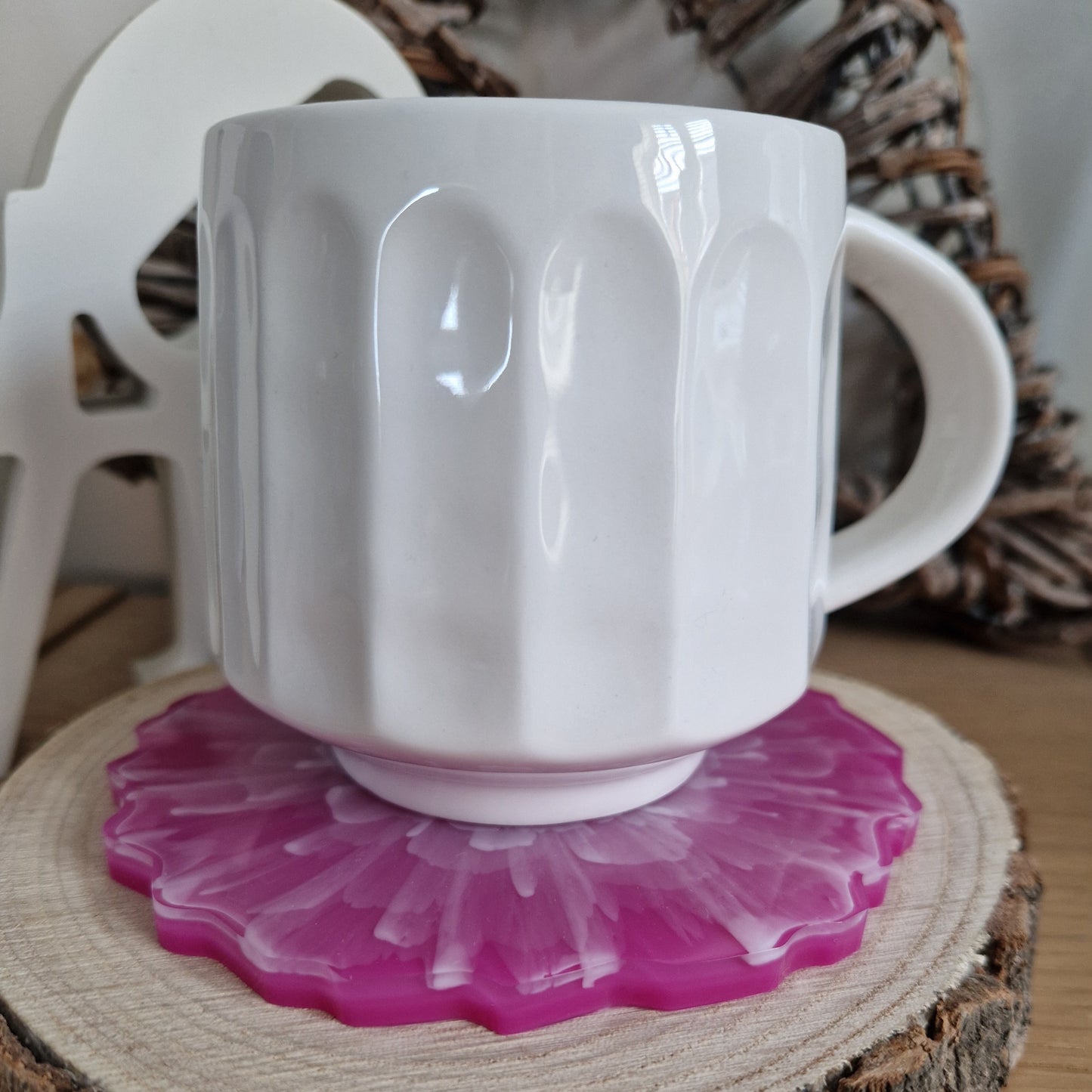Resin bloom coaster with fuchsia alcohol ink design