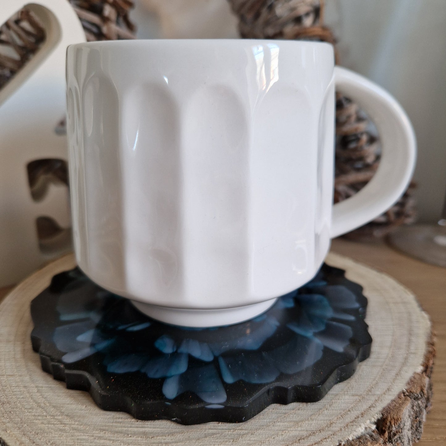 Resin bloom coasters with blue alcohol ink design