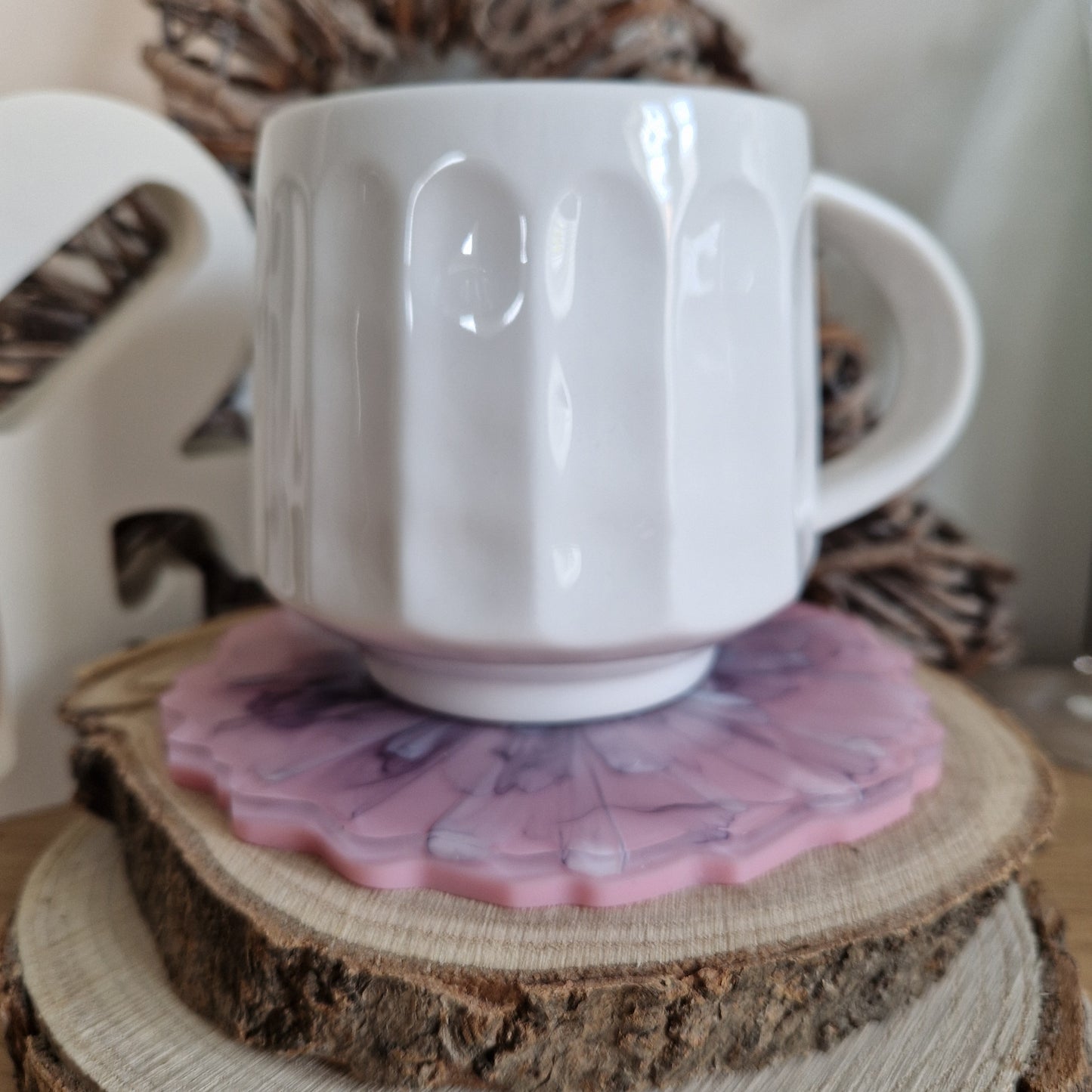 Resin bloom coasters with black and pink alcohol ink design