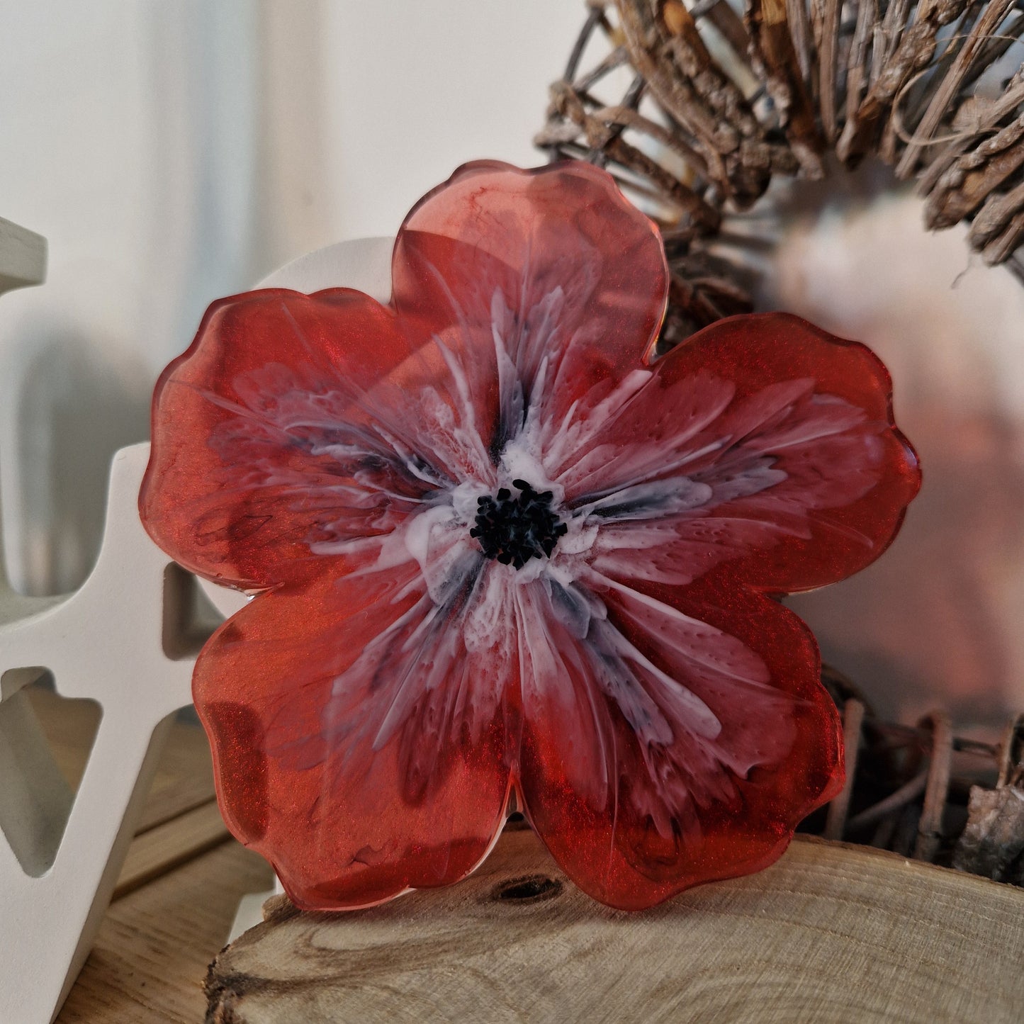 Resin bloom coaster with red alcohol ink design