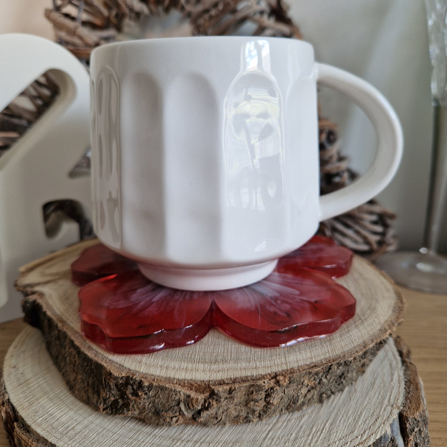 Resin bloom coaster with red alcohol ink design
