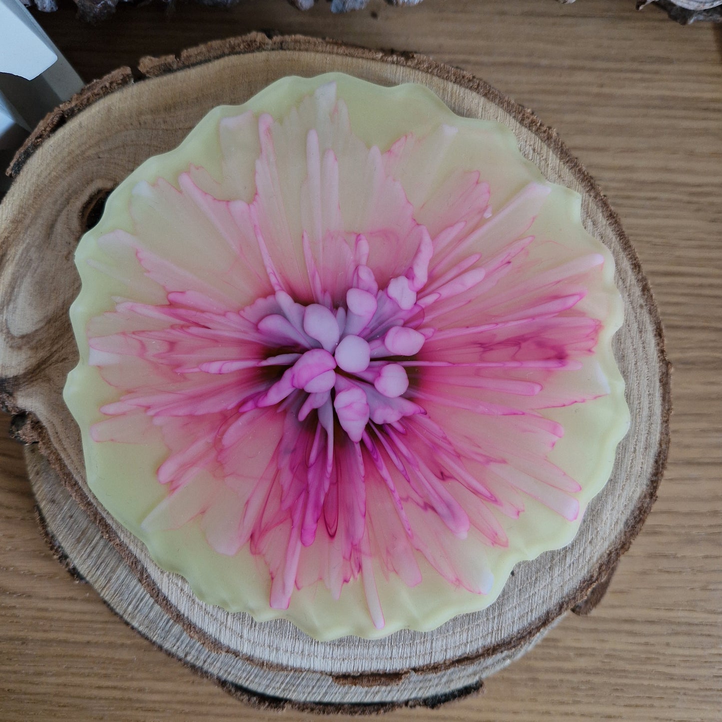 Resin bloom coasters with pink and yellow alcohol ink design