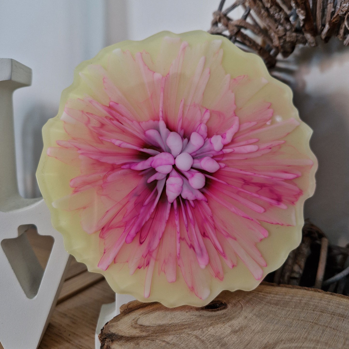 Resin bloom coasters with pink and yellow alcohol ink design