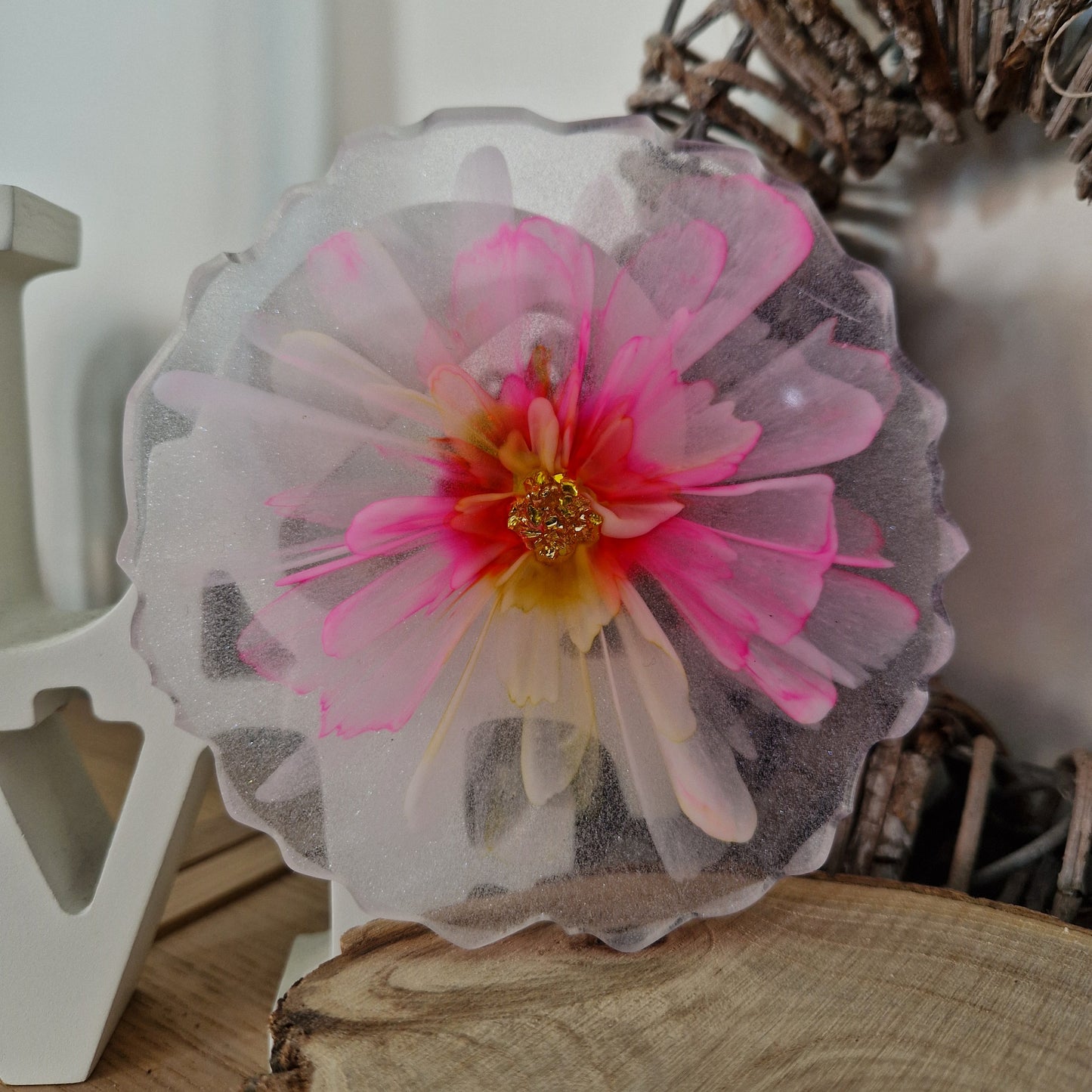Resin bloom coaster with fuchsia and yellow alcohol ink design