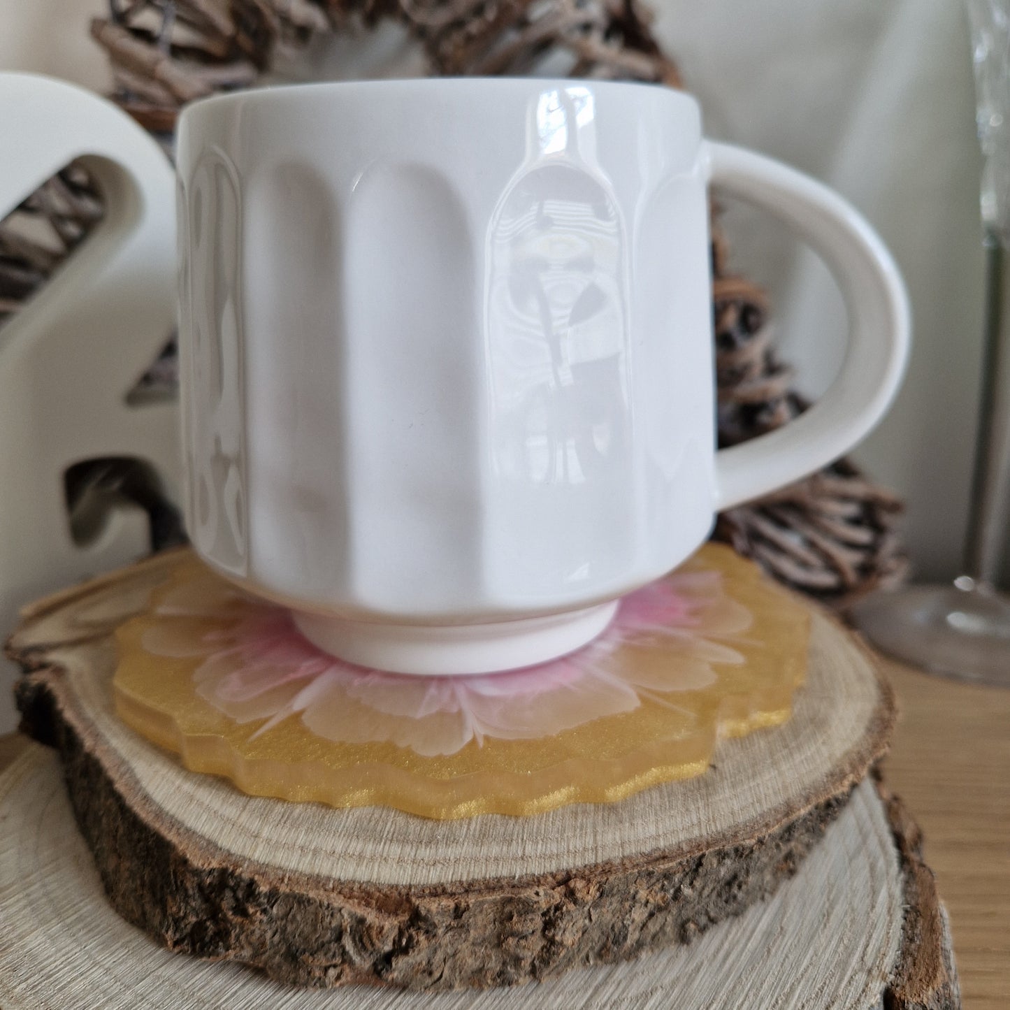 Resin bloom coasters with pink and gold alcohol ink design