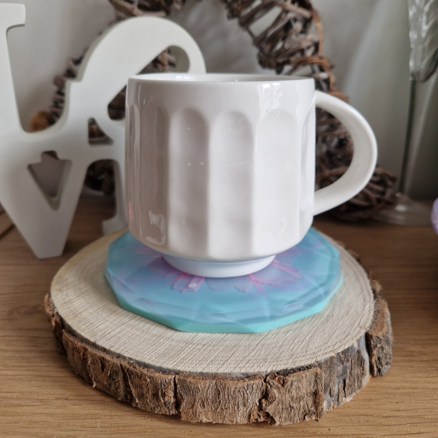 Resin bloom coasters with pink and aqua alcohol ink design