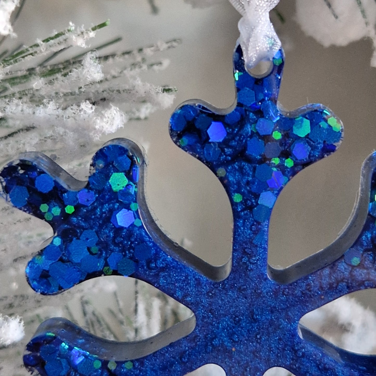 Close up of sapphire resin snowflake decoration