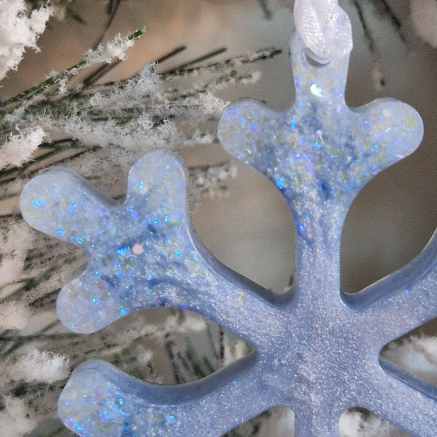 Close up of ice blue resin snowflake decoration