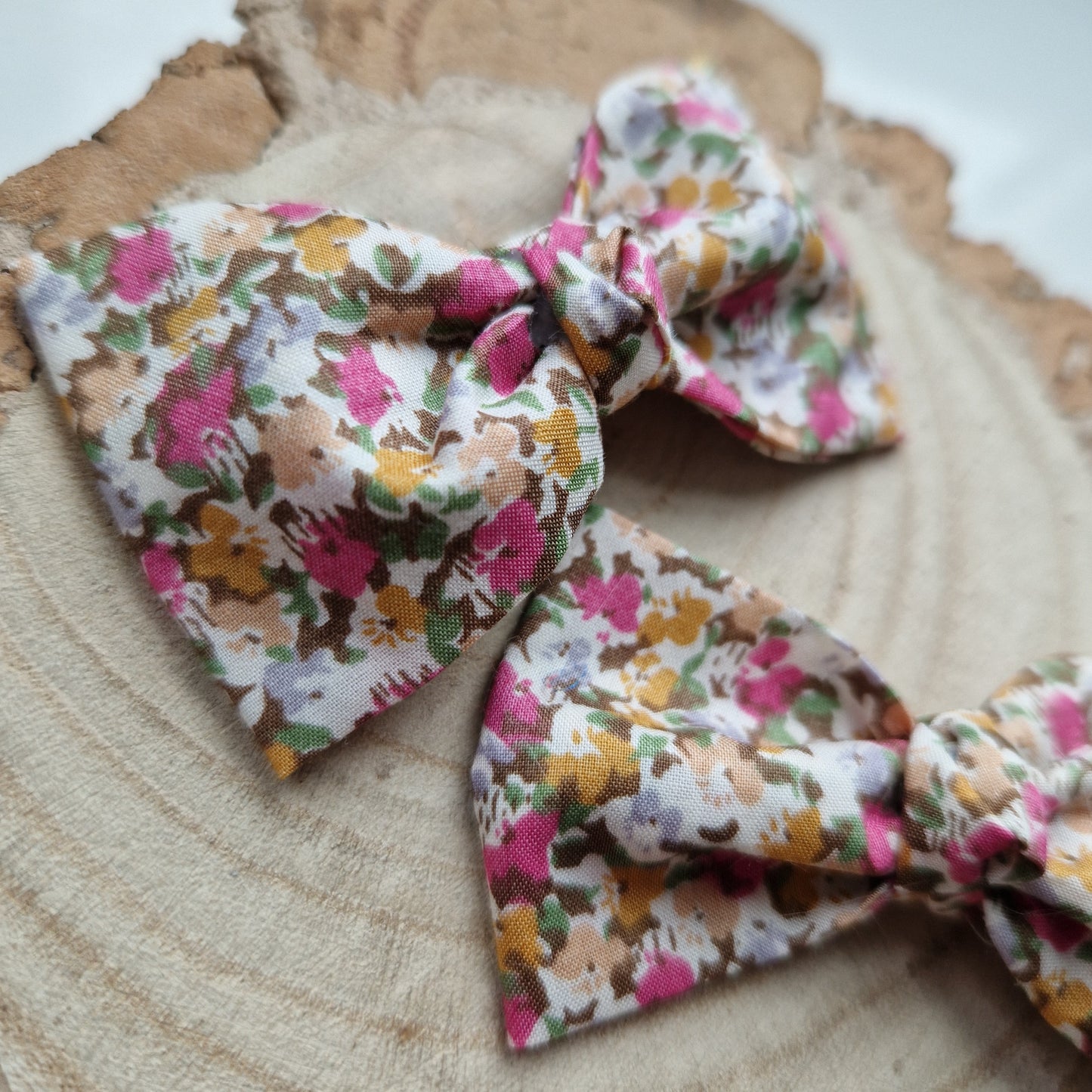 Pair of dinky vintage Liberty print hair bows in ditsy pink floral fabric
