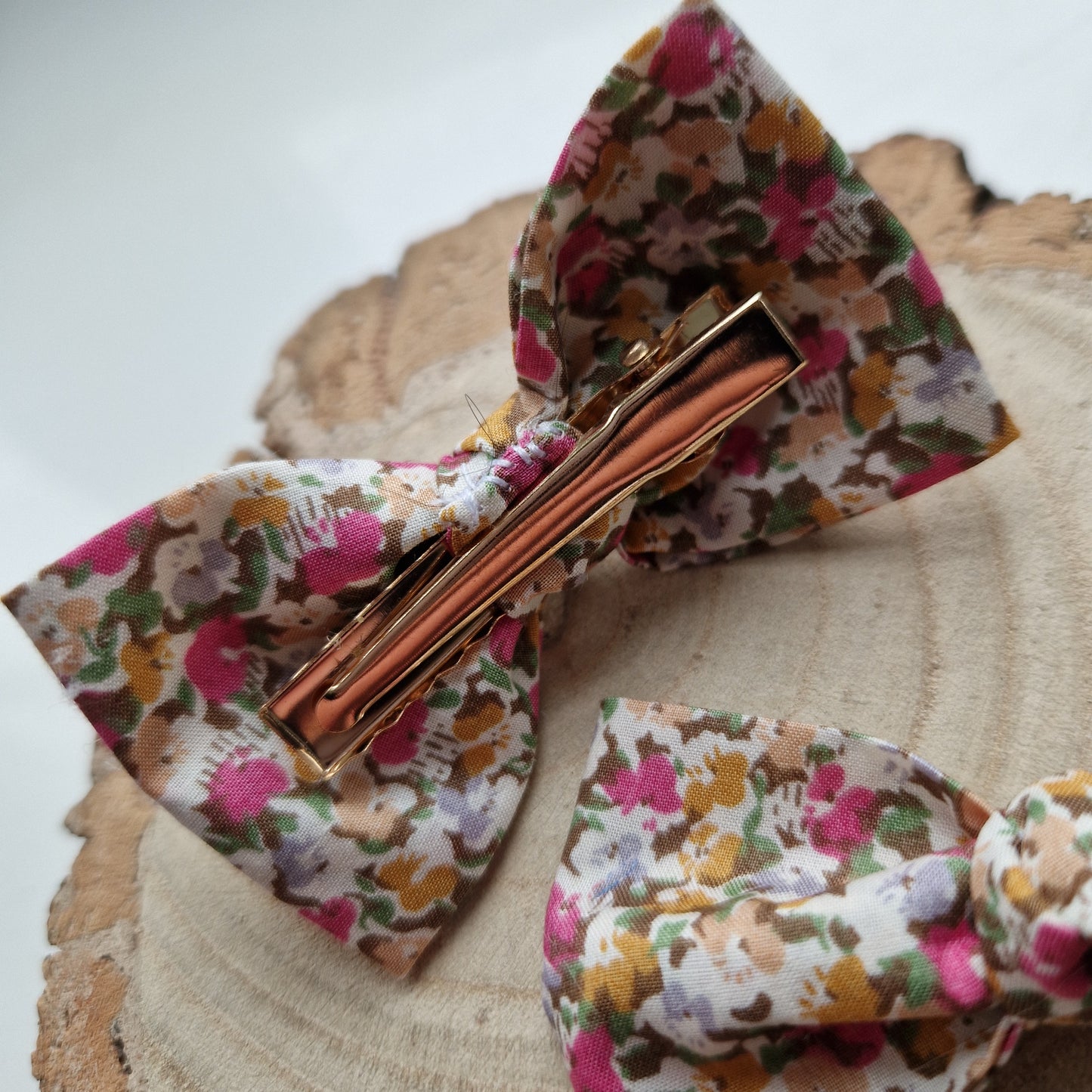 Pair of dinky vintage Liberty print hair bows in ditsy pink floral fabric