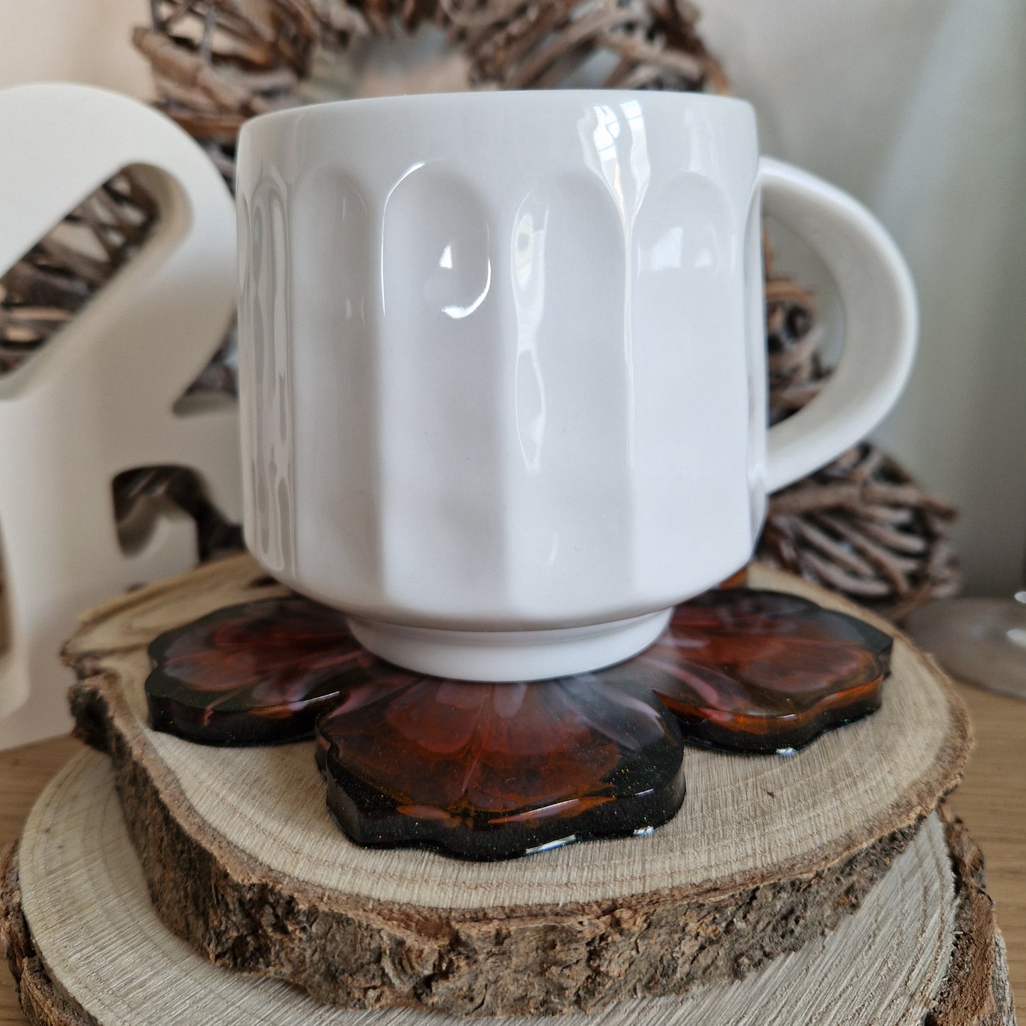 Resin bloom coasters with red alcohol ink design