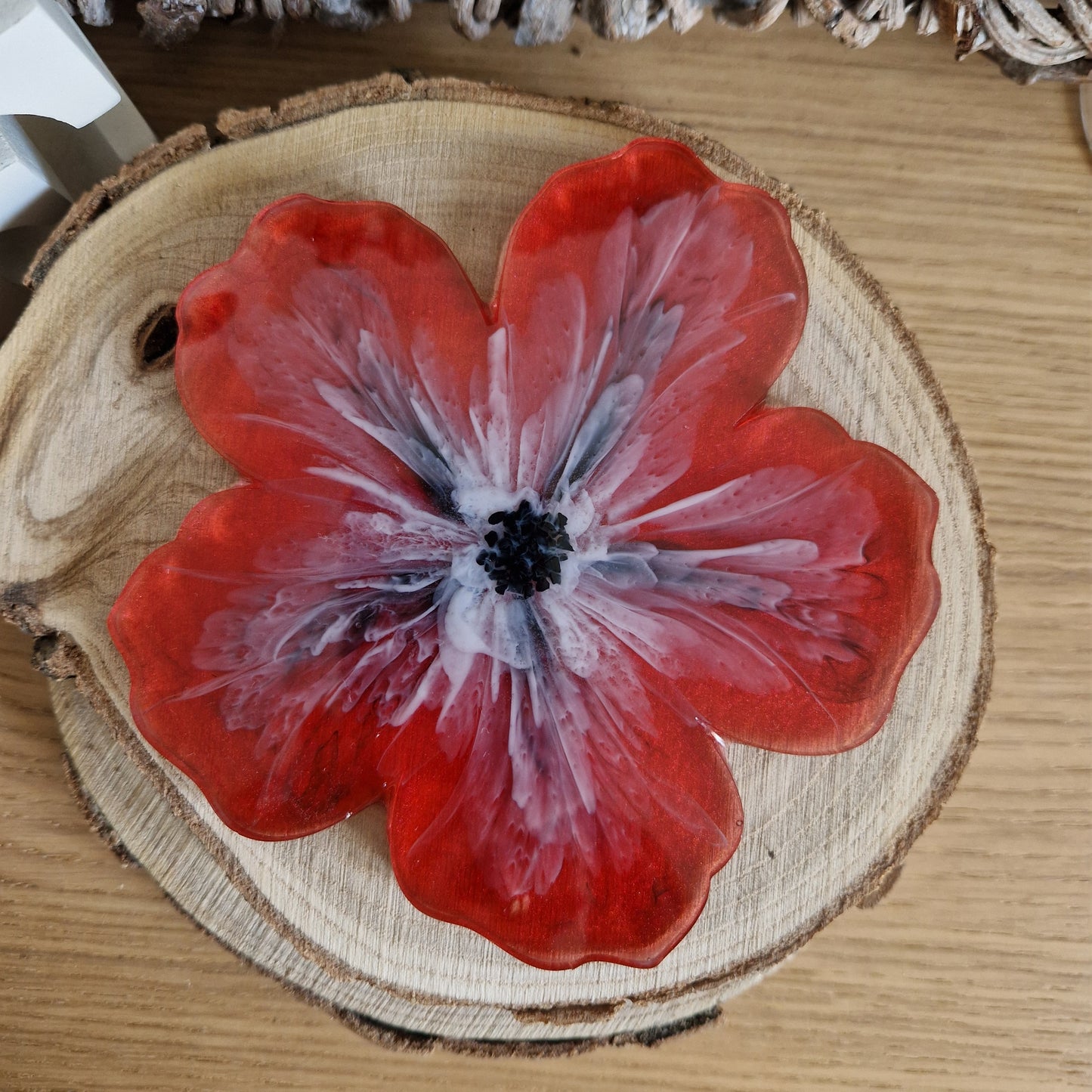 Resin bloom coaster with red alcohol ink design