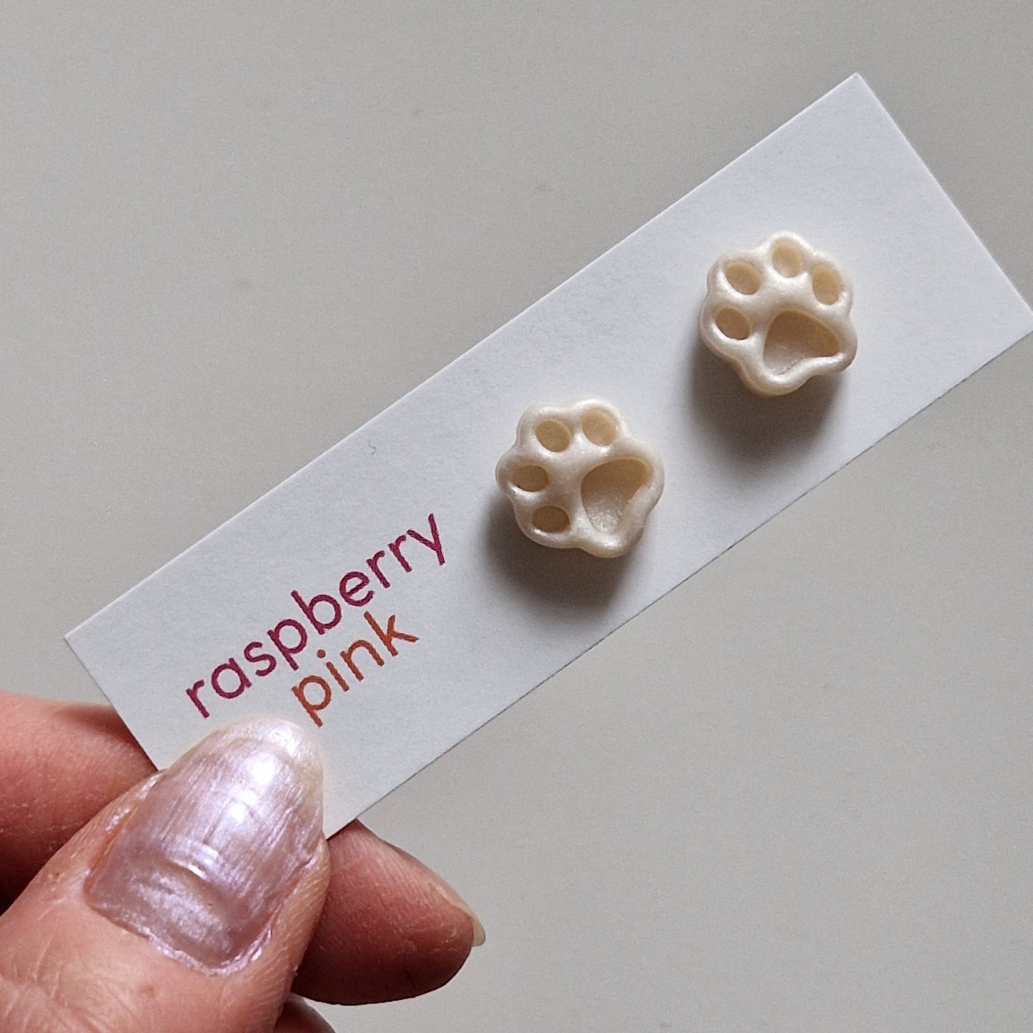 Clay Tiny Paw Print Stud Earrings - Debossed Ivory Shimmer