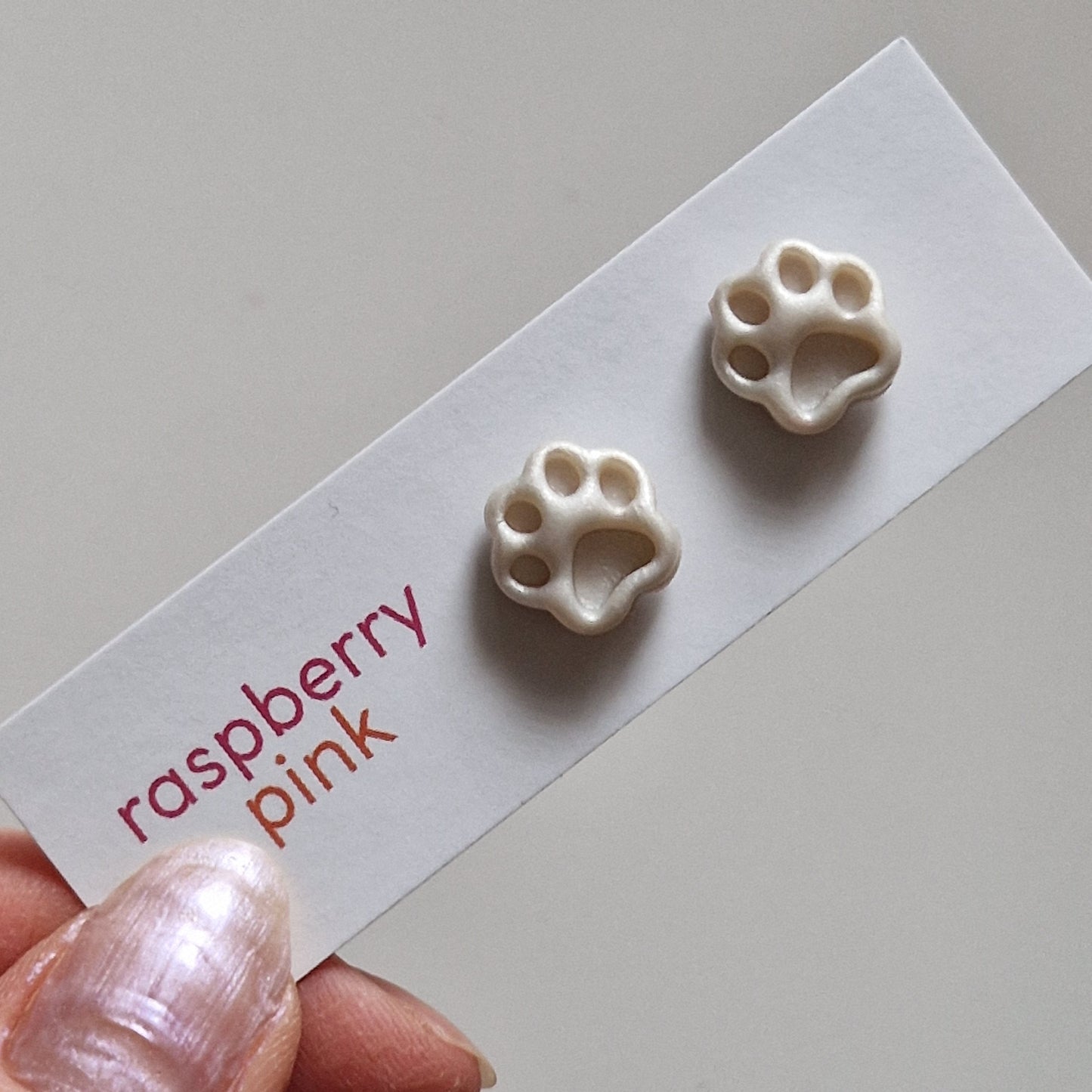 Clay Tiny Paw Print Stud Earrings - Debossed Pearl