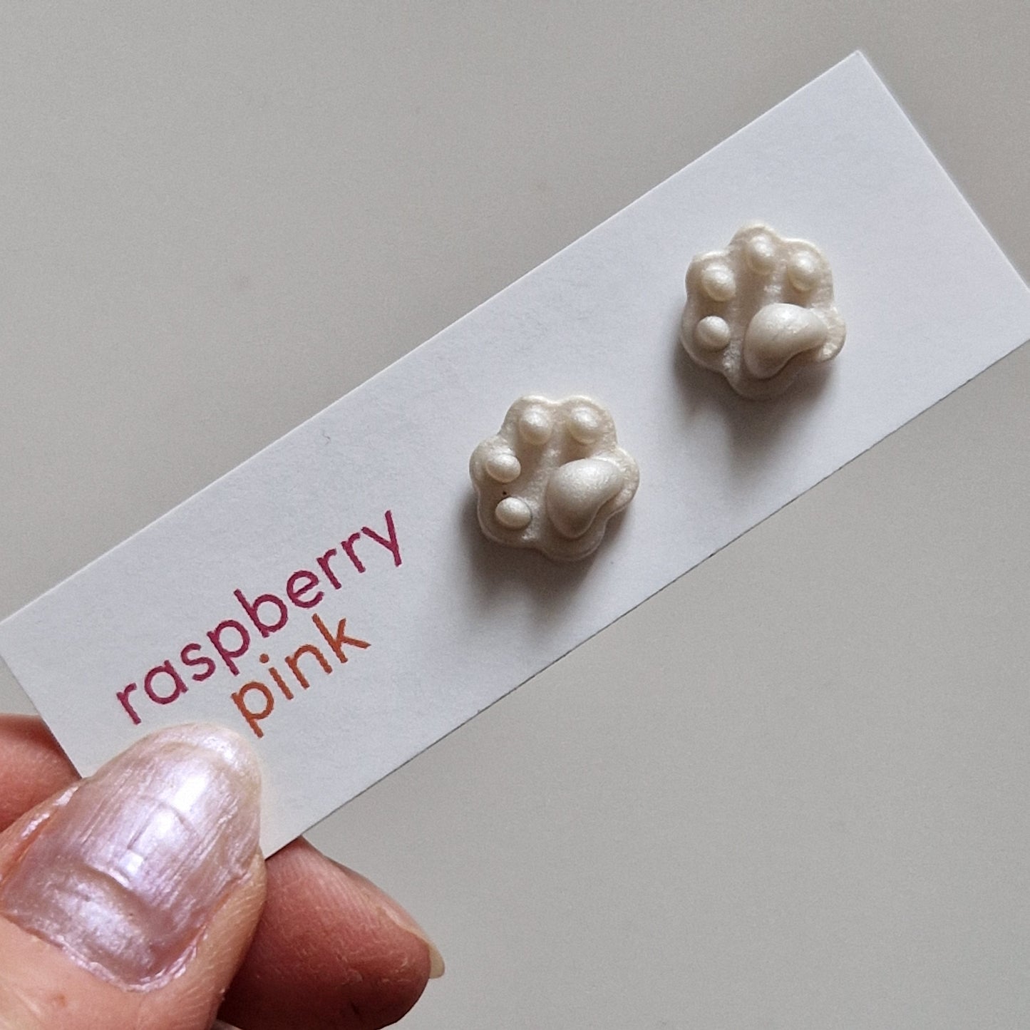 Clay Tiny Paw Print Stud Earrings - Embossed Pearl