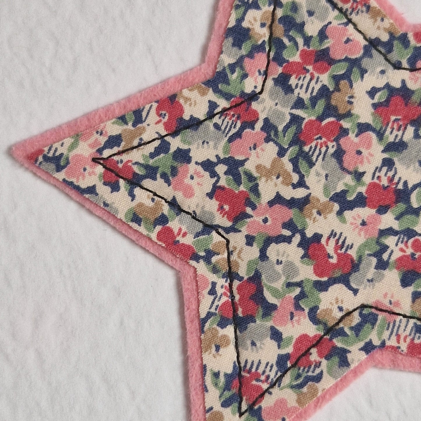 Vintage Liberty star card with a pink floral star and a new baby girl sentiment
