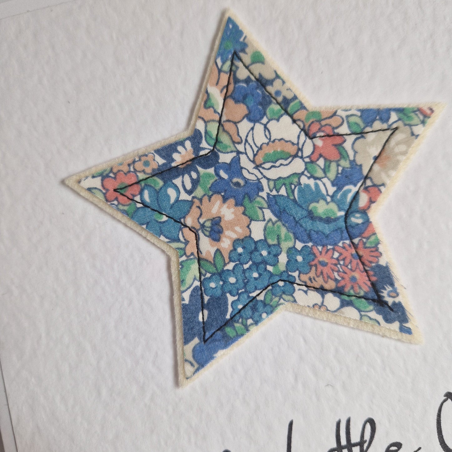 Vintage Liberty star card with a blue floral star and hello little one sentiment