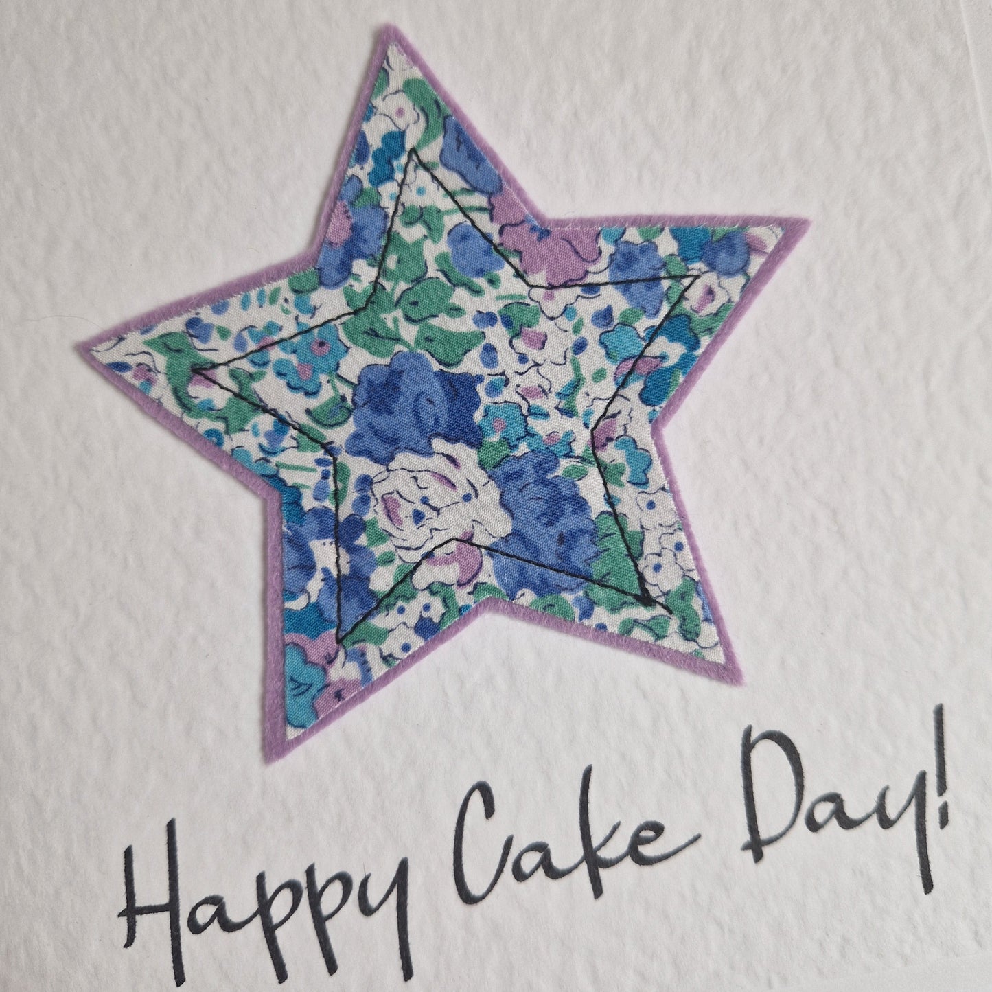 Vintage Liberty star card with a blue floral star and happy cake day sentiment