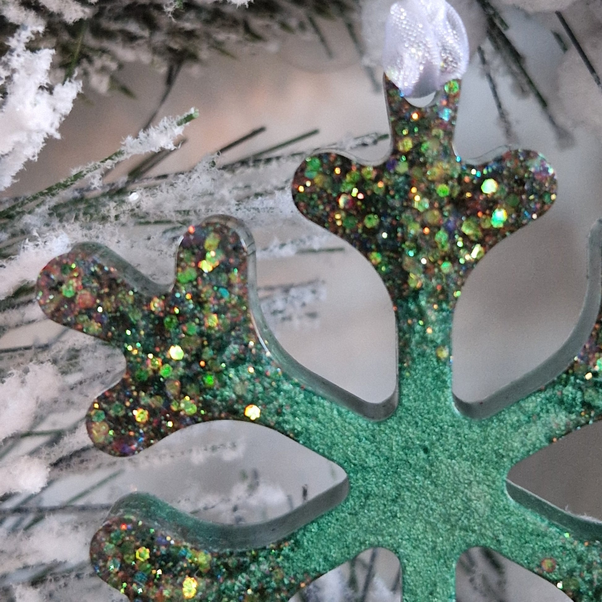 Close up of green resin snowflake decoration