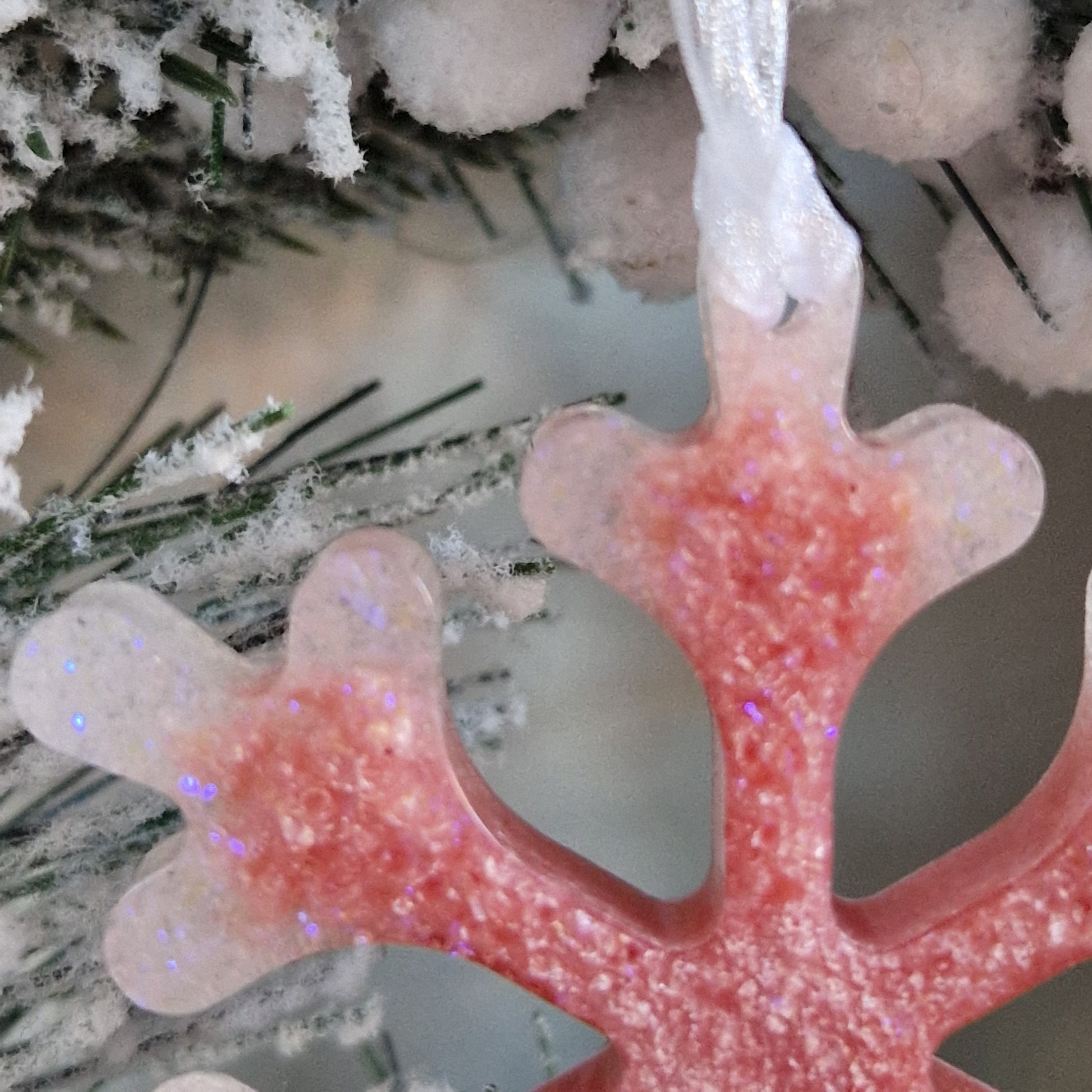Close up of baby pink resin snowflake decoration