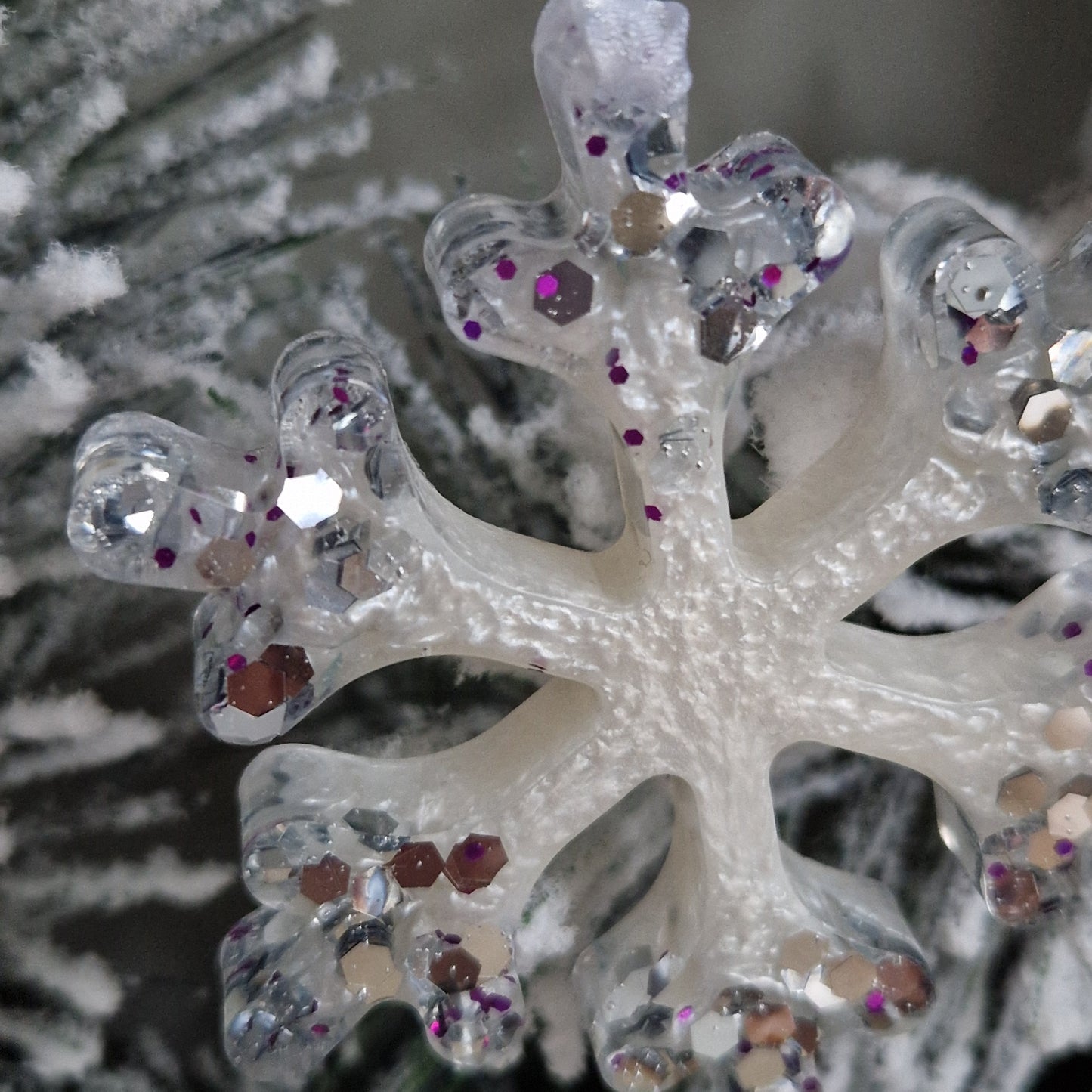 Close up of white and silver resin snowflake decoration