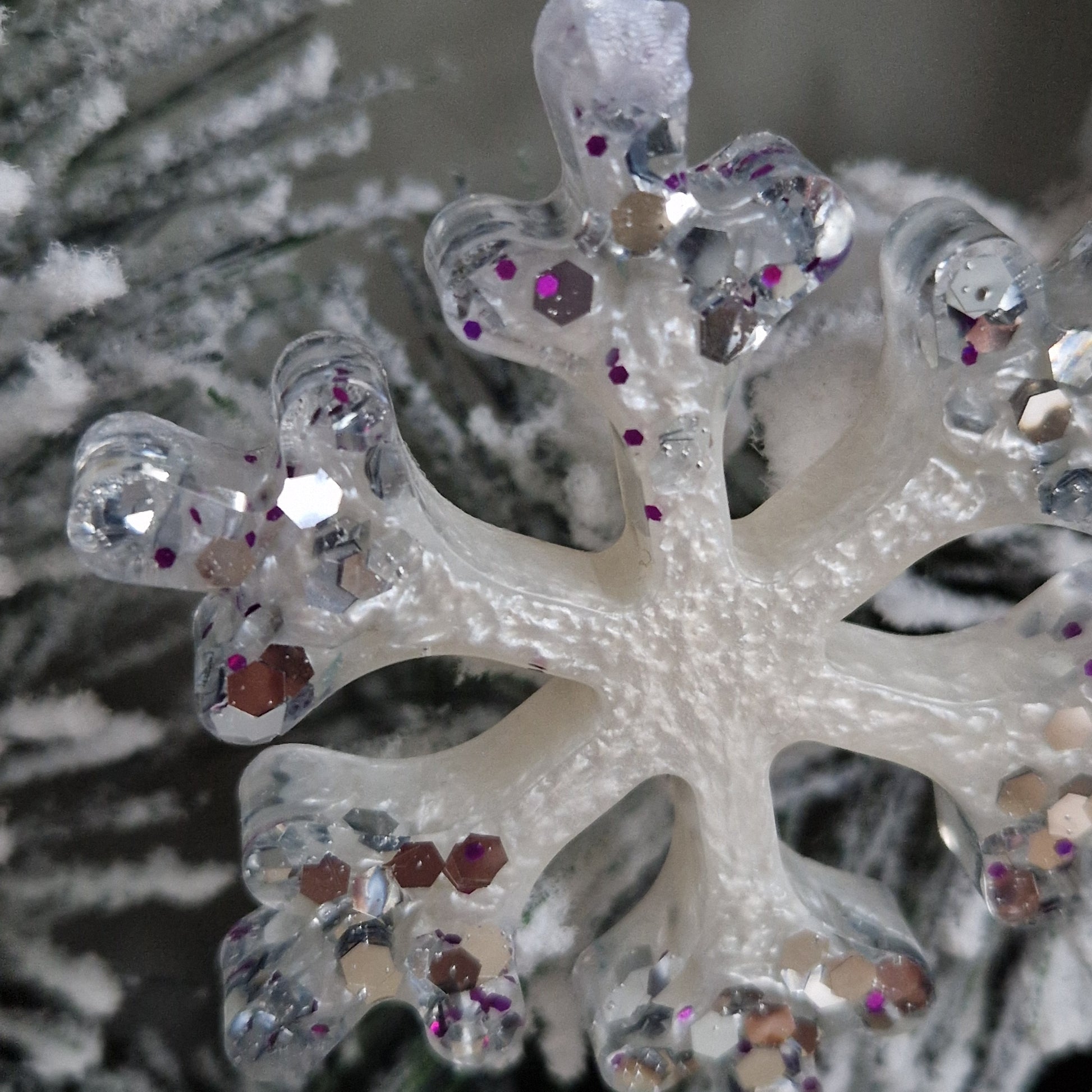 Close up of white and silver resin snowflake decoration