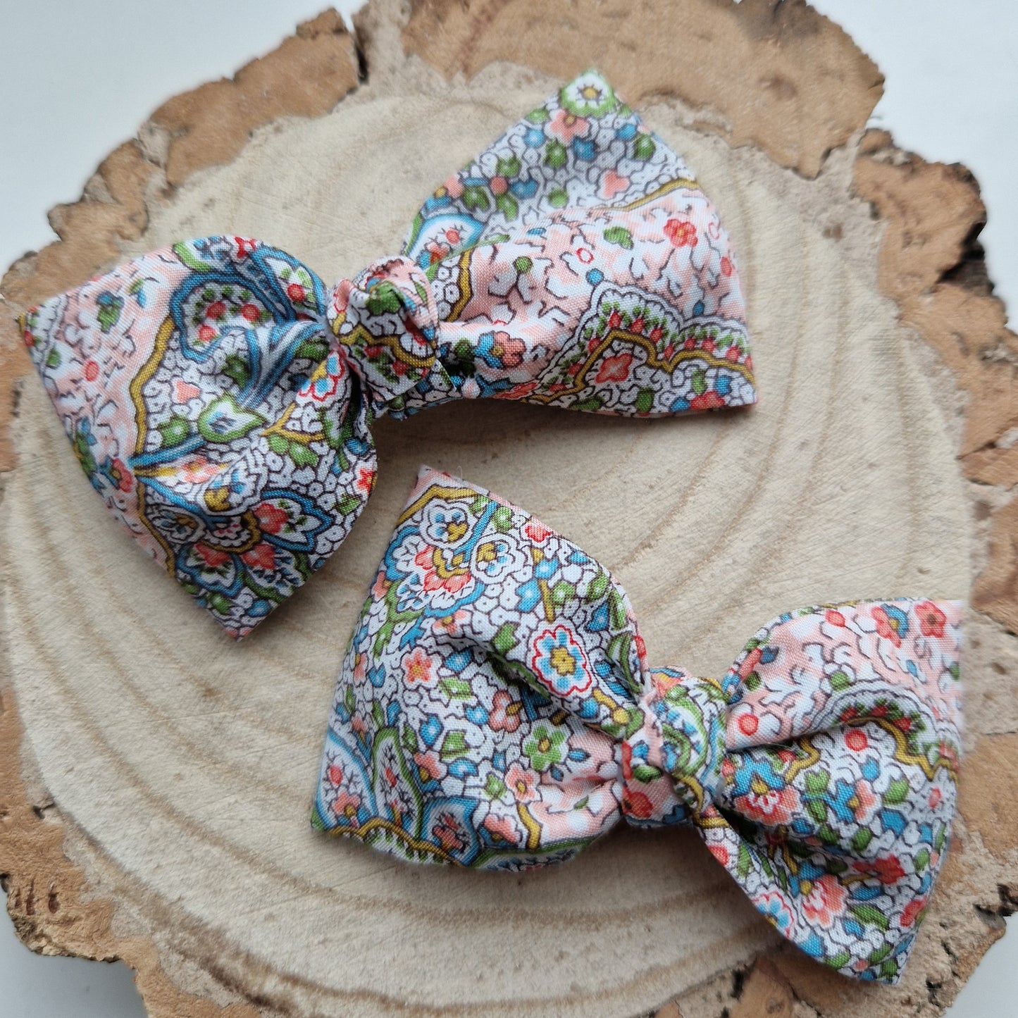 Pair of dinky vintage Liberty print hair bows in pastel paisley fabric