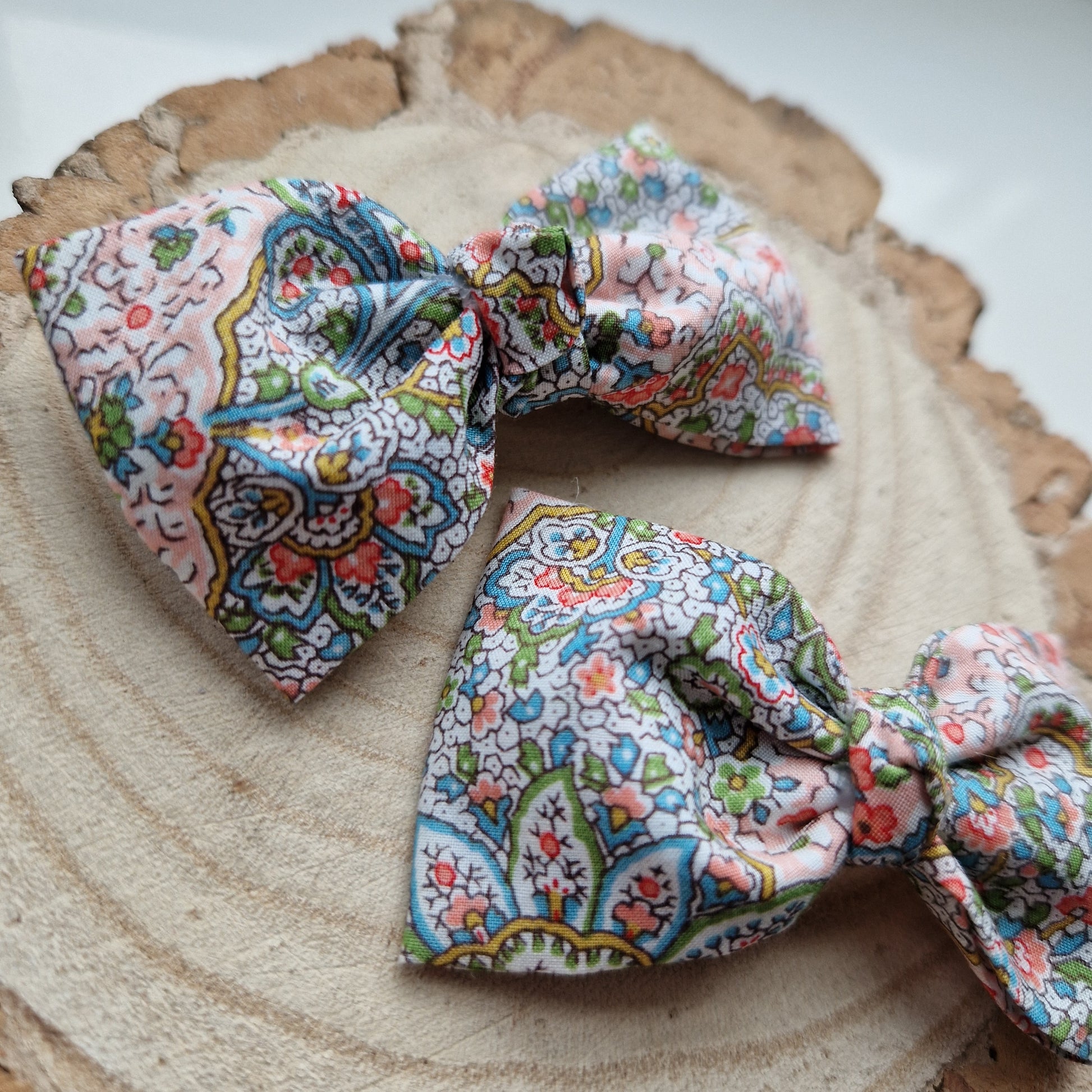 Pair of dinky vintage Liberty print hair bows in pastel paisley fabric