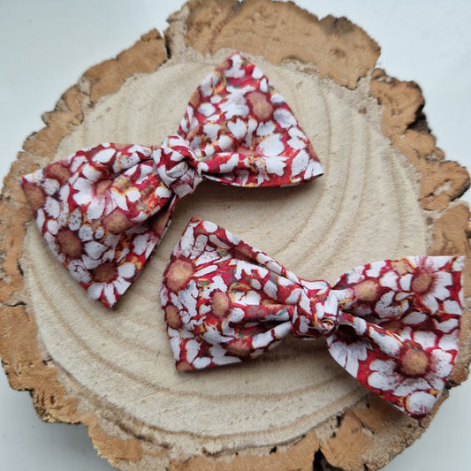 Pair of dinky vintage Liberty print hair bows in orange floral fabric