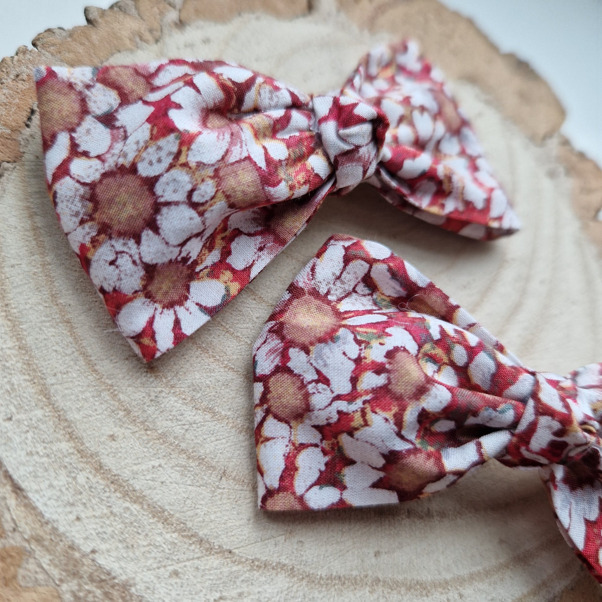 Pair of dinky vintage Liberty print hair bows in orange floral fabric