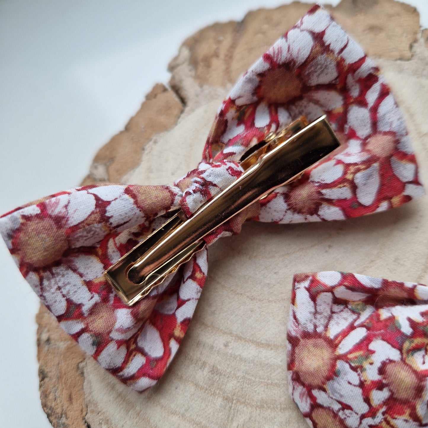 Pair of dinky vintage Liberty print hair bows in orange floral fabric