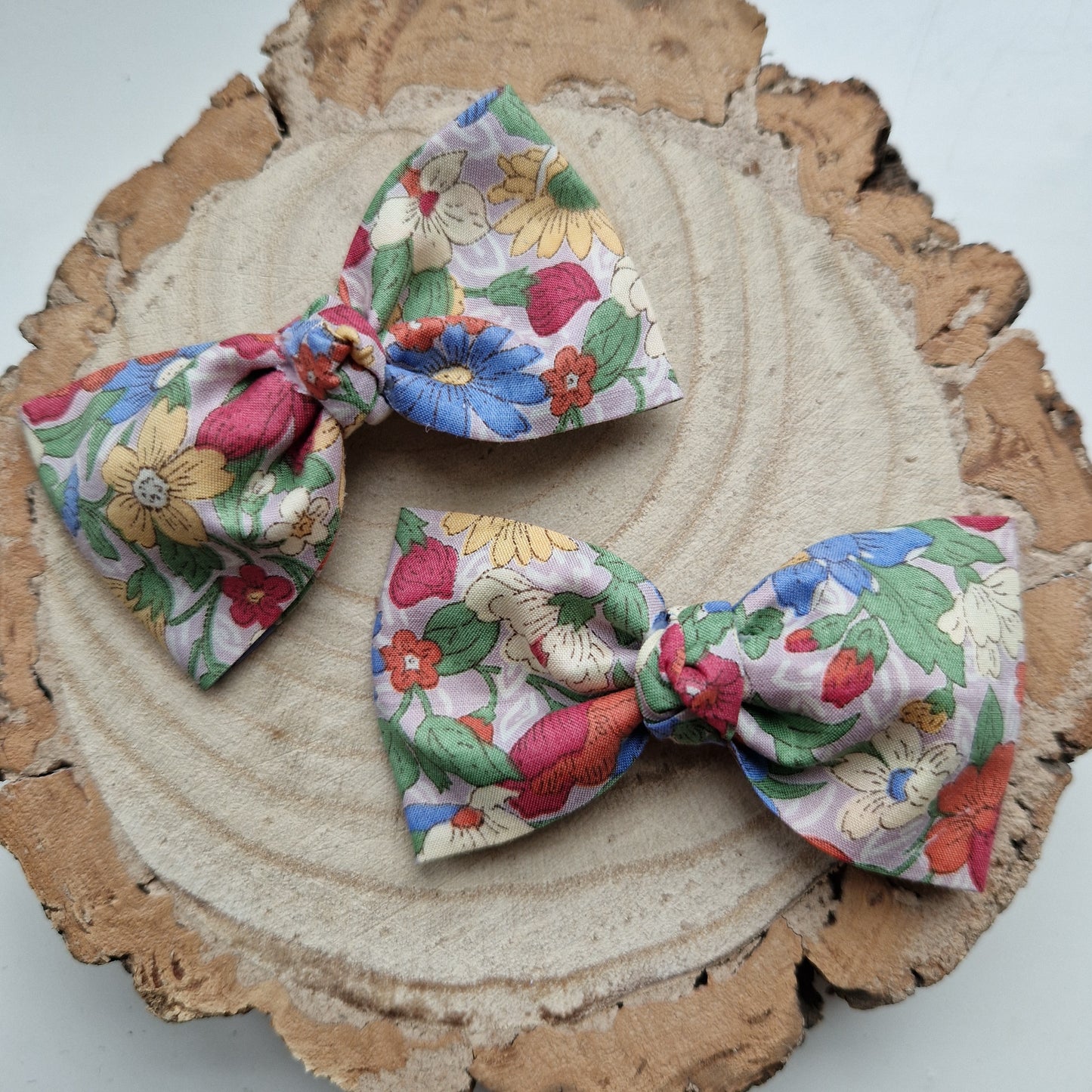 Pair of dinky vintage Liberty print hair bows in bright floral fabric