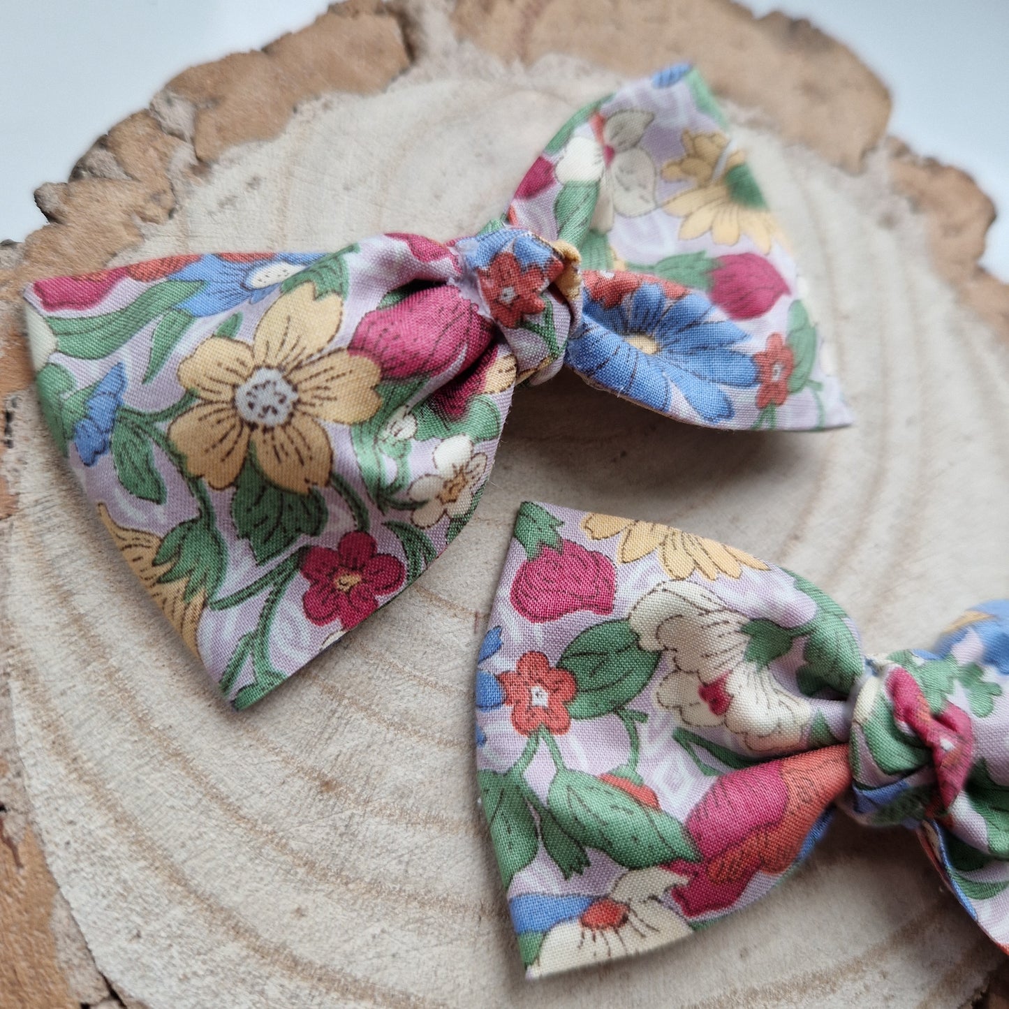 Pair of dinky vintage Liberty print hair bows in bright floral fabric