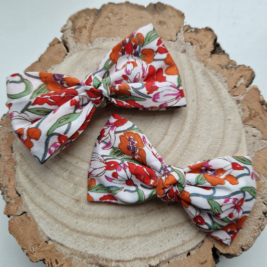 Pair of dinky vintage Liberty print hair bows in orange floral fabric