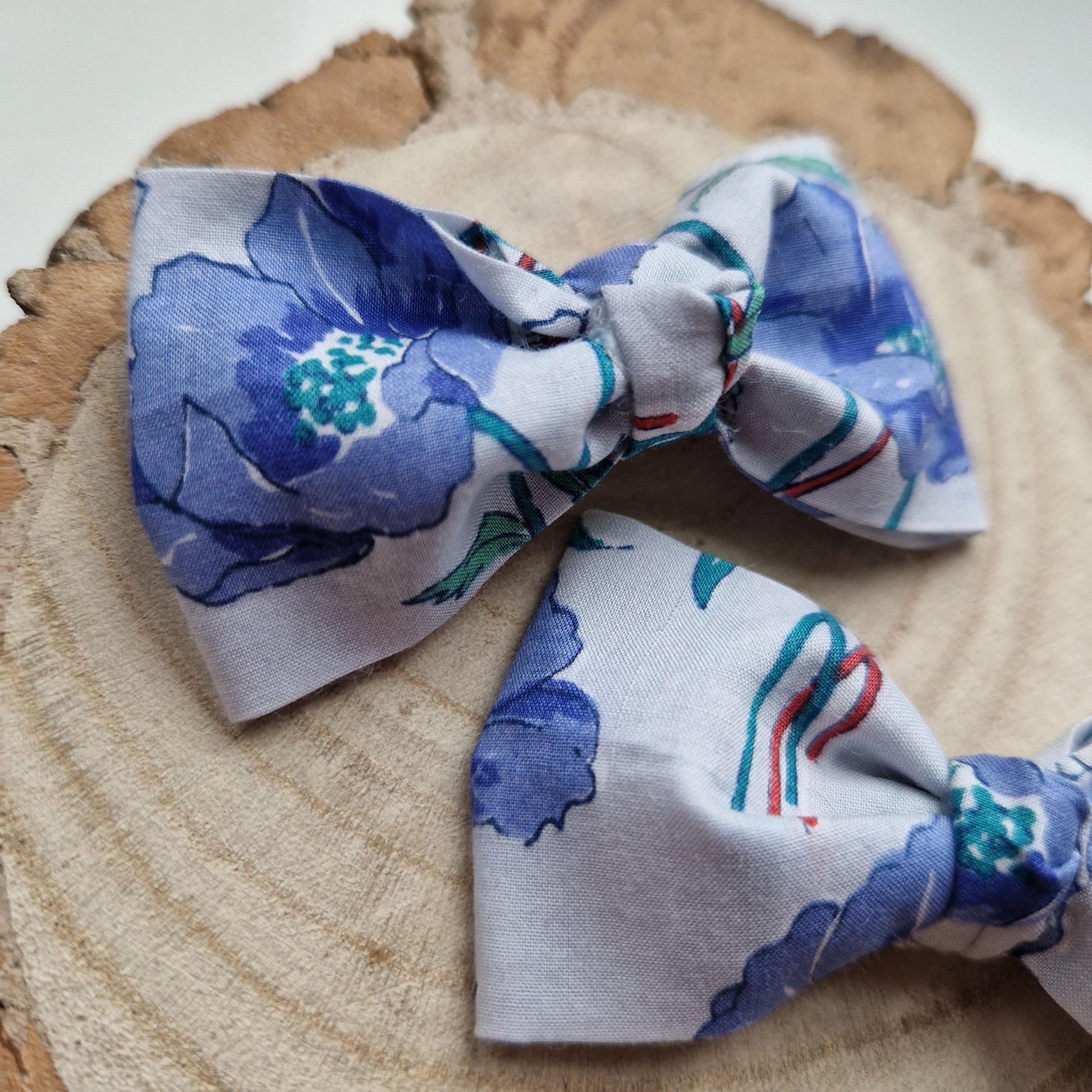 Pair of dinky vintage Liberty print hair bows in blue poppy fabric