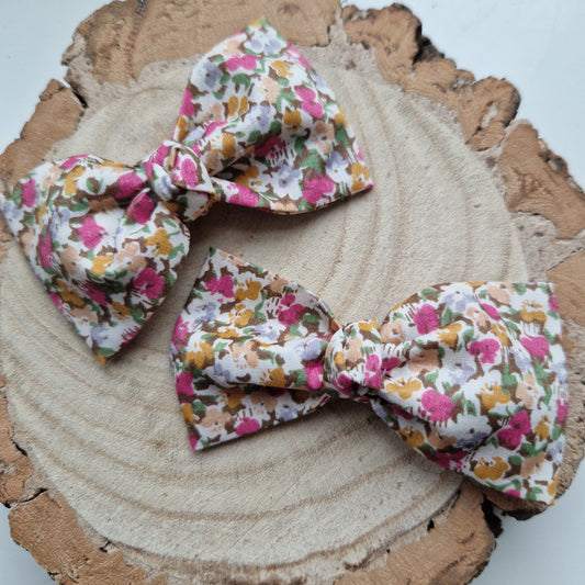 Pair of dinky vintage Liberty print hair bows in ditsy pink floral fabric