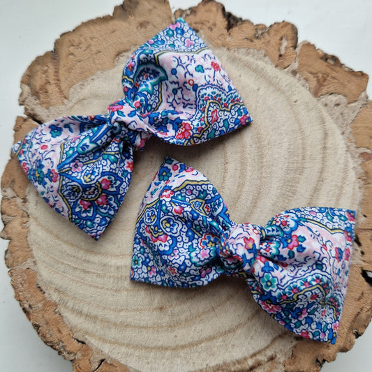 Pair of dinky vintage Liberty print hair bows in blue paisley fabric