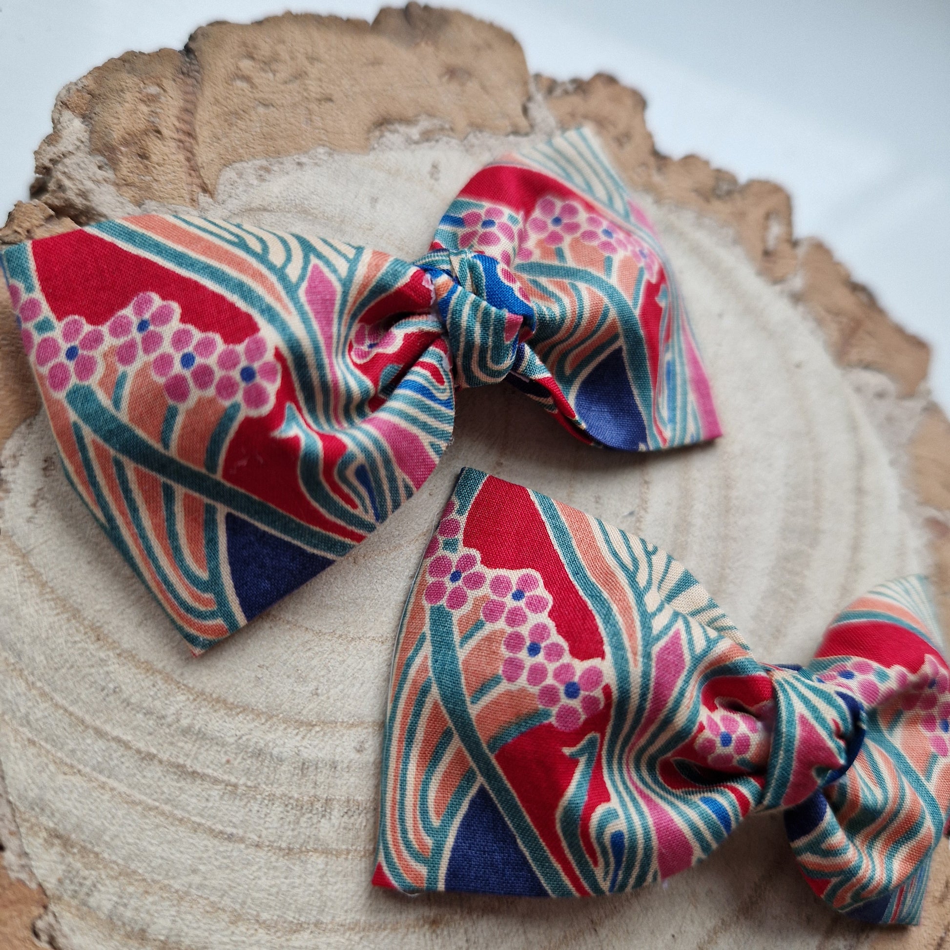 Pair of dinky vintage Liberty print hair bows in red and blue art deco fabric