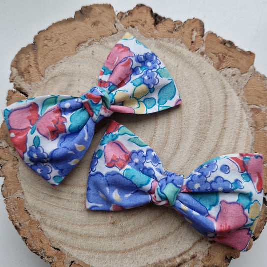 Pair of dinky vintage Liberty print hair bows in red and blue floral fabric