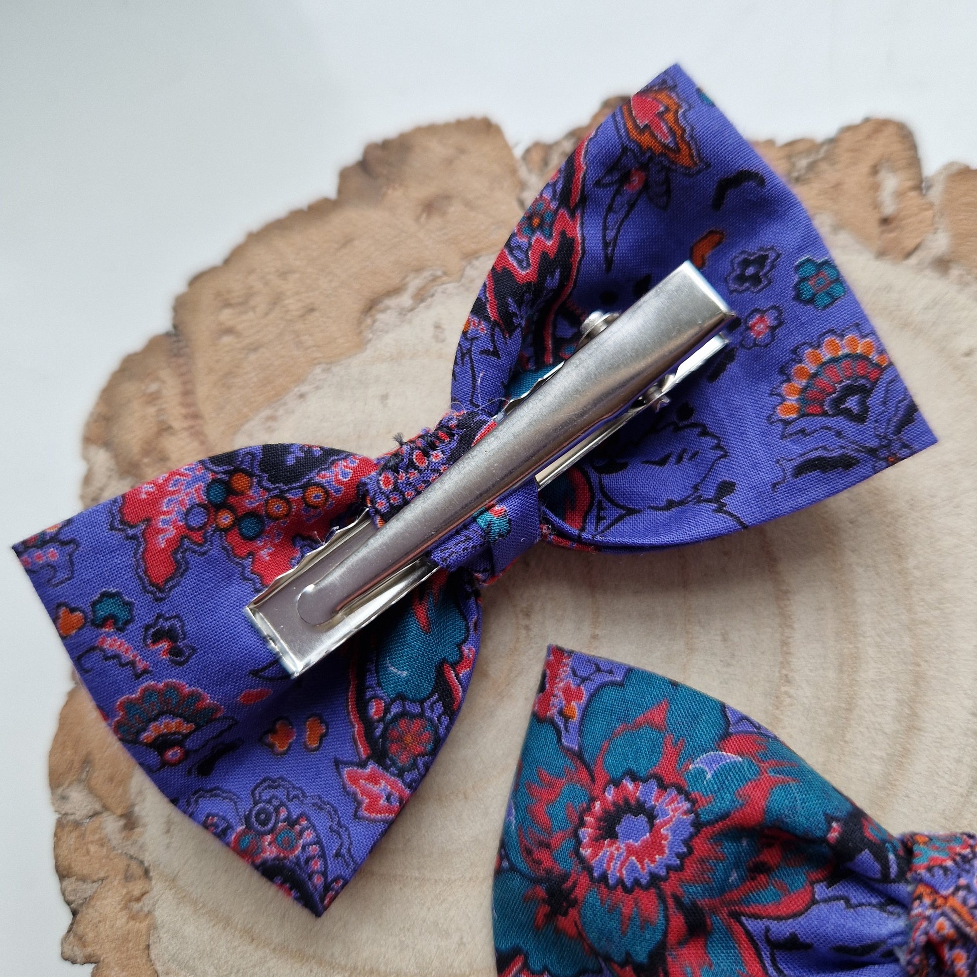 Pair of dinky vintage Liberty print hair bows in purple paisley fabric